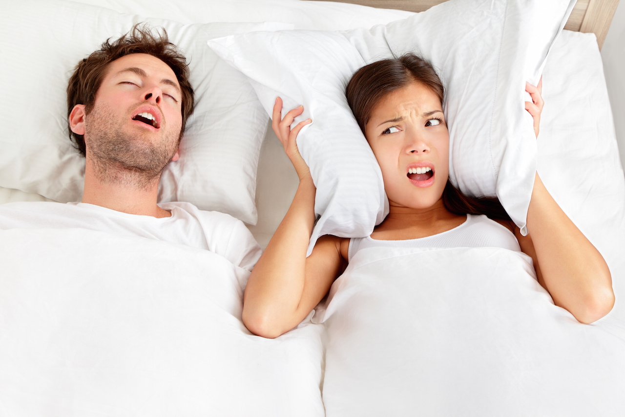 Snoring man couple in bed